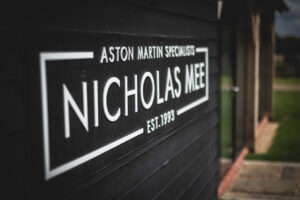 Nicholas Mee logo who provide Aston Martin car, parts and services