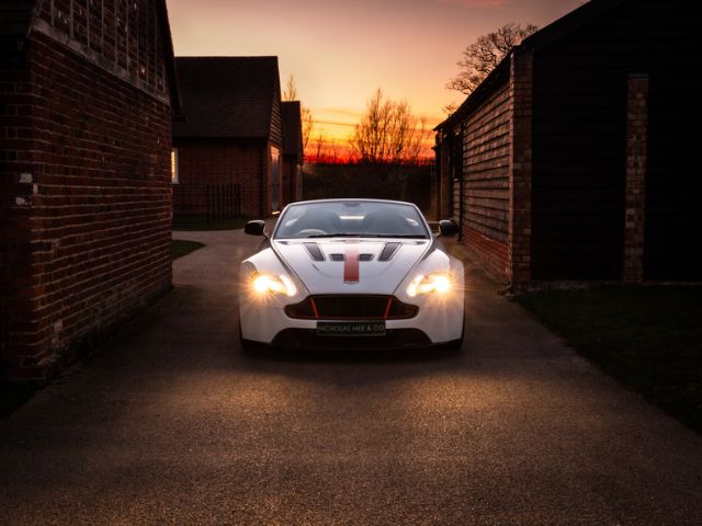 Sunset photo of the Aston Martin V12 Vantage Car at Nicholas Mee & Company Dealership