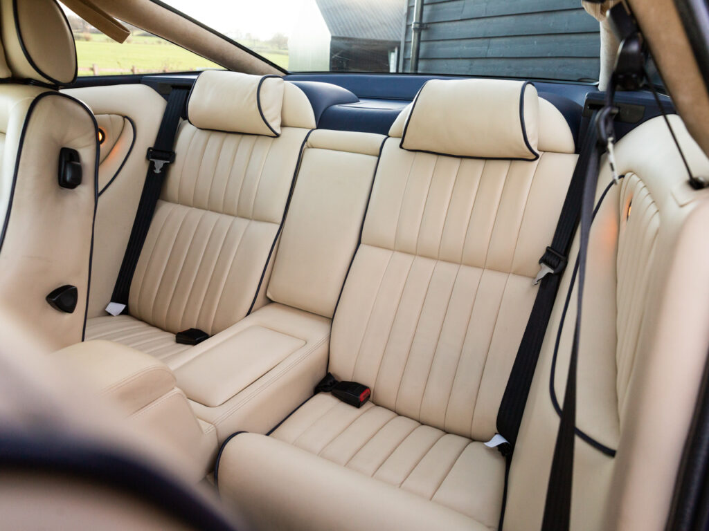 The Interior is made with Parchment and Navy Blue hide interior